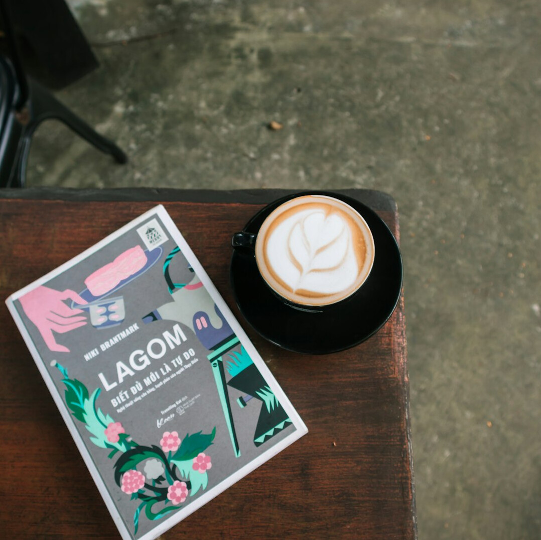 Open book and cup of coffee on a cozy table